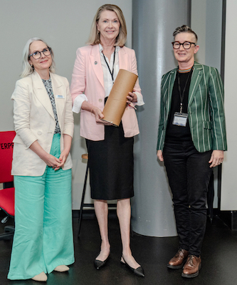 Margie Jantti (center) from the University of Wollongong receives the CAUL Distinguished Service Award from CAUL CEO Jane Angel (left) and CAUL Board Chair Nicole Clark (right)